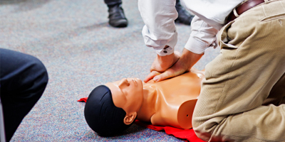 Man issuing CPR to dummy