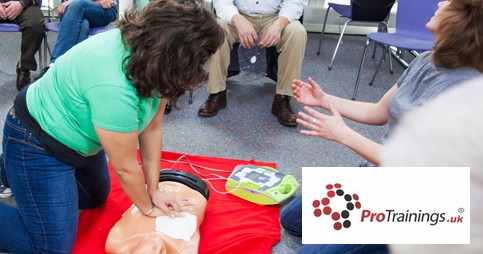 Woman providing CPR care to dummy