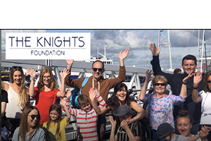 The Knights Foundation people waving in row